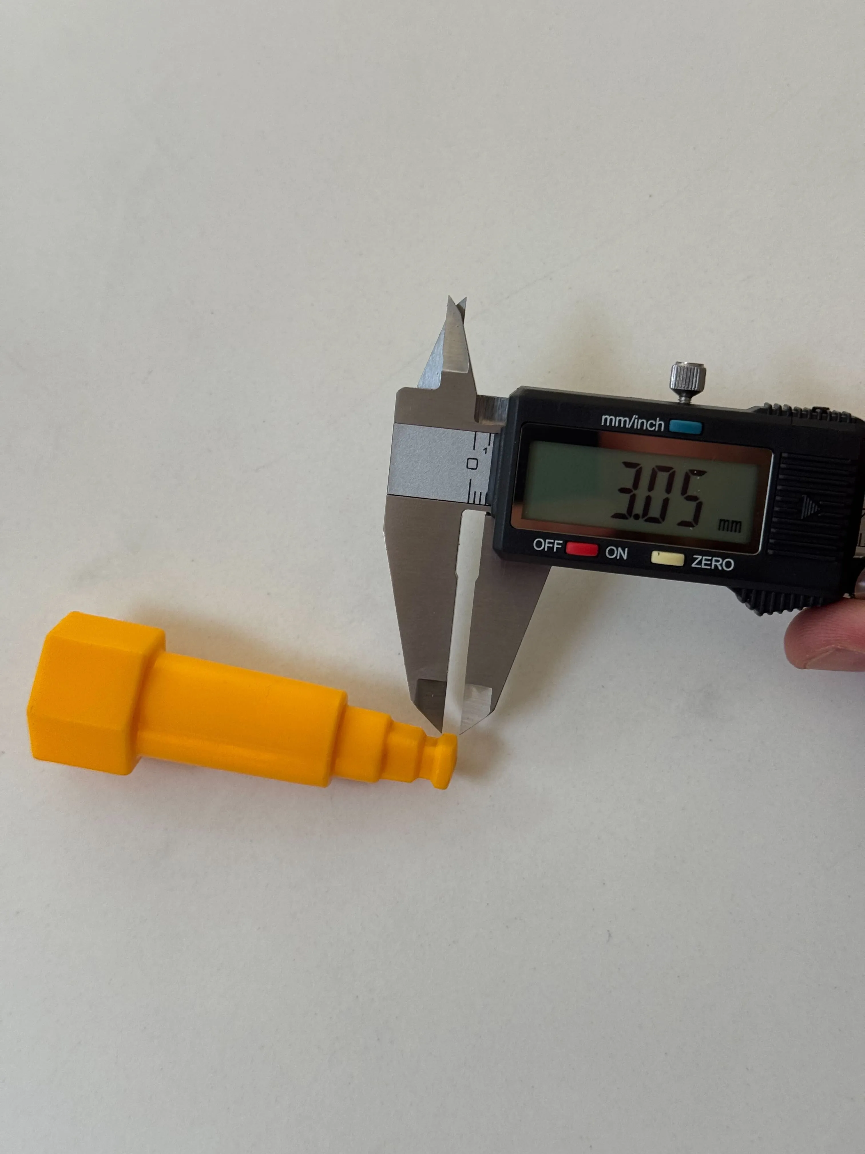 A printed drill bit measured with calipers reading 3.05 mm