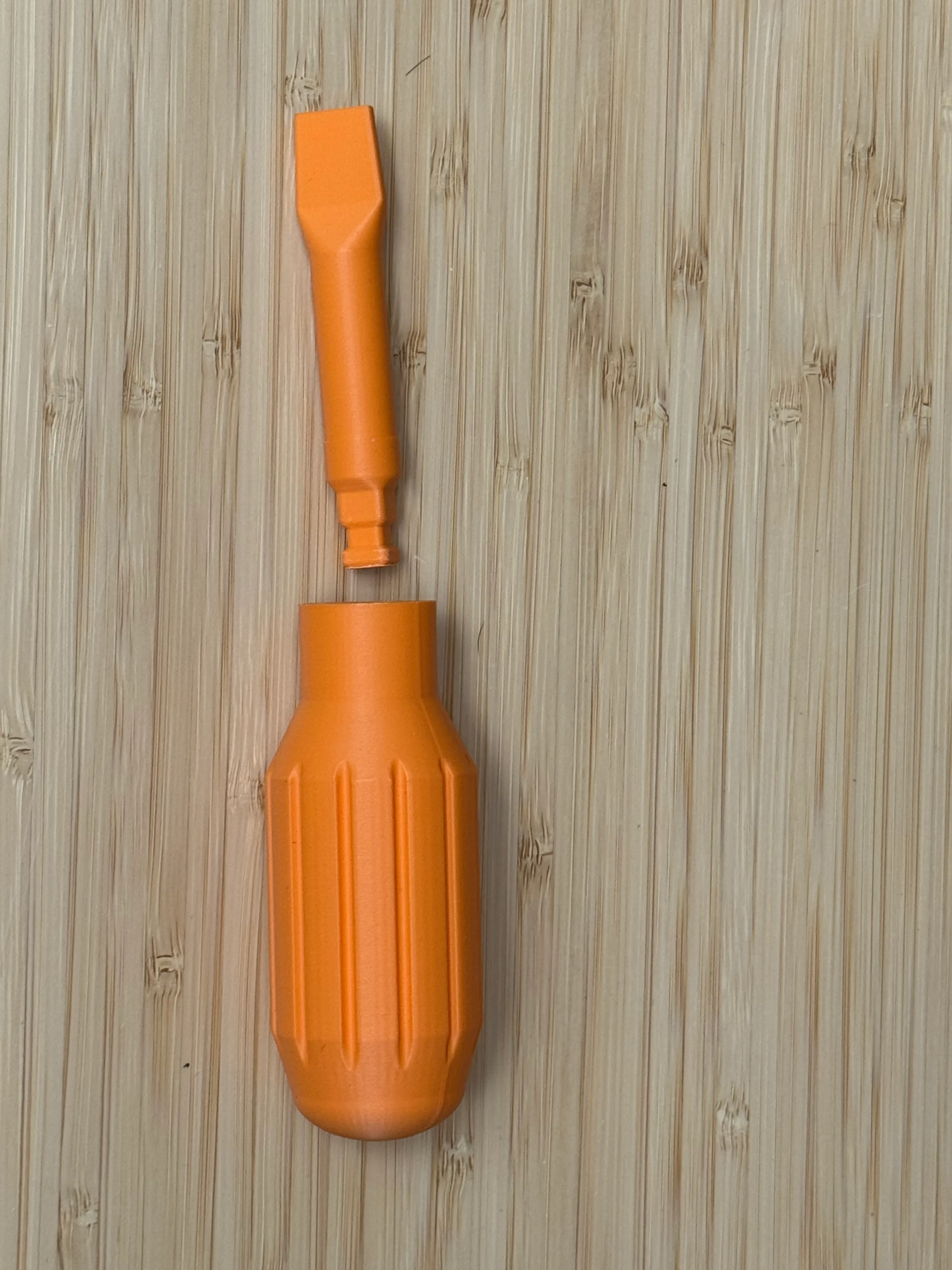 The printed screwdriver handle and its flathead bit, separated